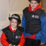 Mari (left) and Holly (right) in the police officer uniforms