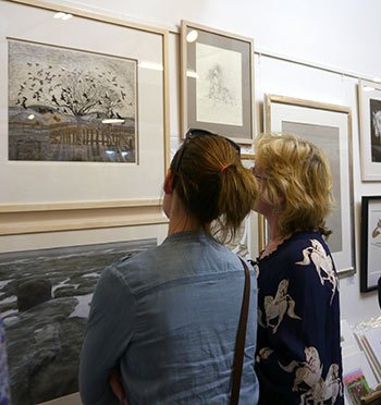 Visitors admiring the winning entry by Tredegar artist Kay Leverton 